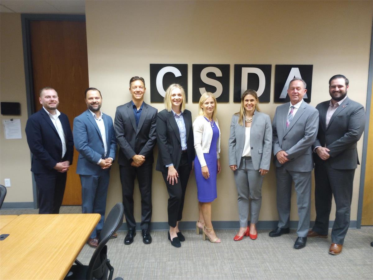 Maggy Krell Meeting photo of group standing in CSDA office